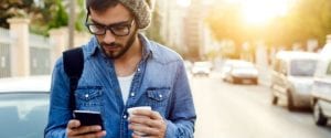 Man In Hat Texting With A Coffee Tsb 755 315